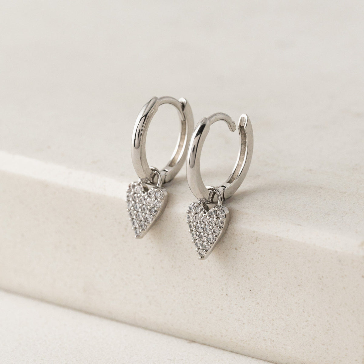 The Flutter Heart Huggie Drop Hoop Earrings